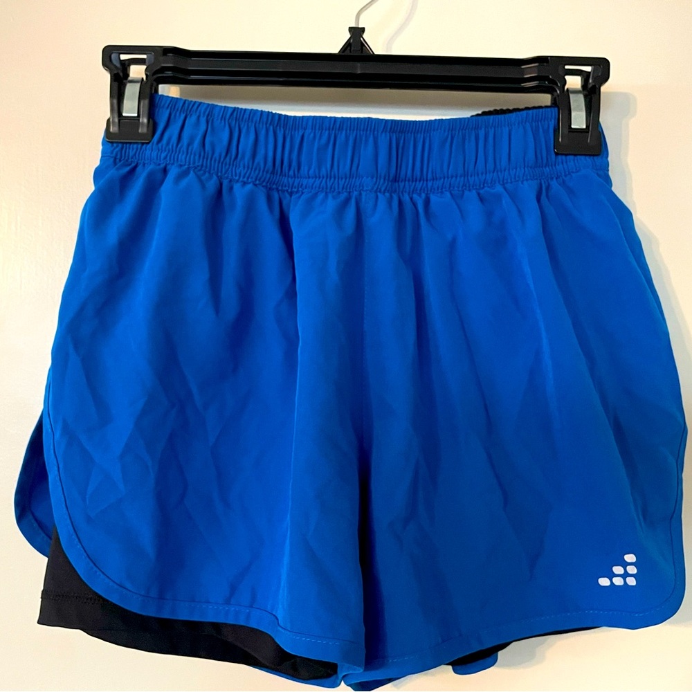 2 pairs of BCG running women’s shorts with black biker shorts liner